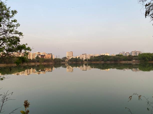 istock Lake with modern city landscape 1386114036