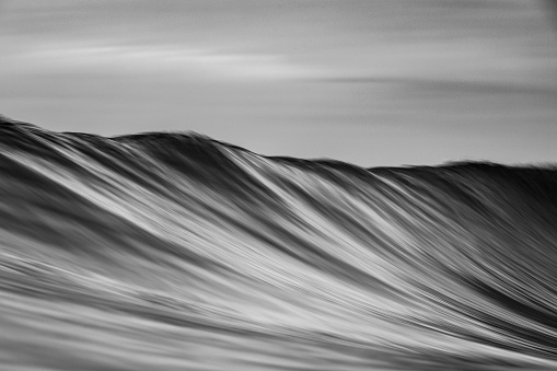 Black and white slow shutter ocean wave pattern