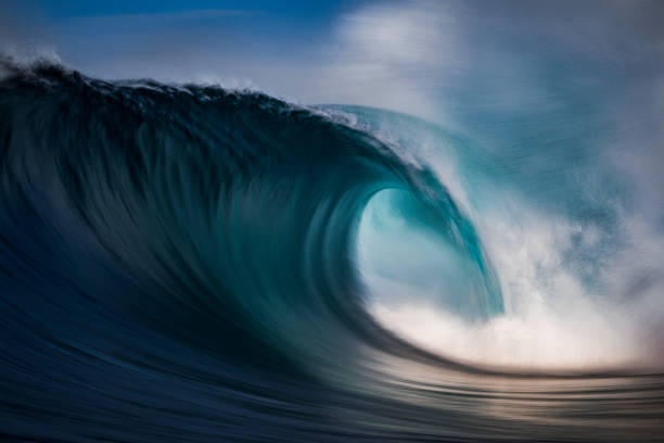 istock Defocused motion of blue ocean wave 1386133106