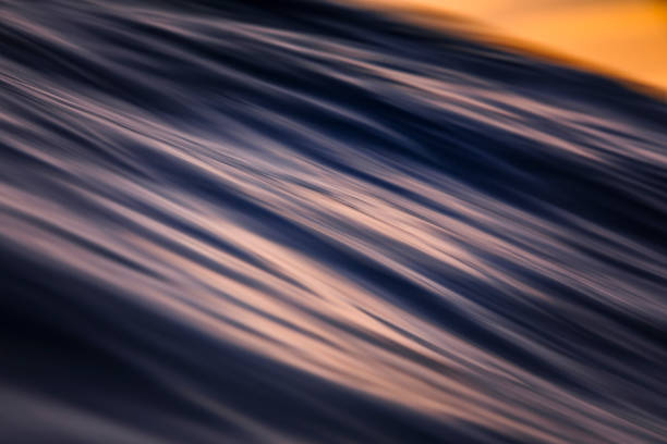 Extreme close up of slow shutter pattern of waters surface