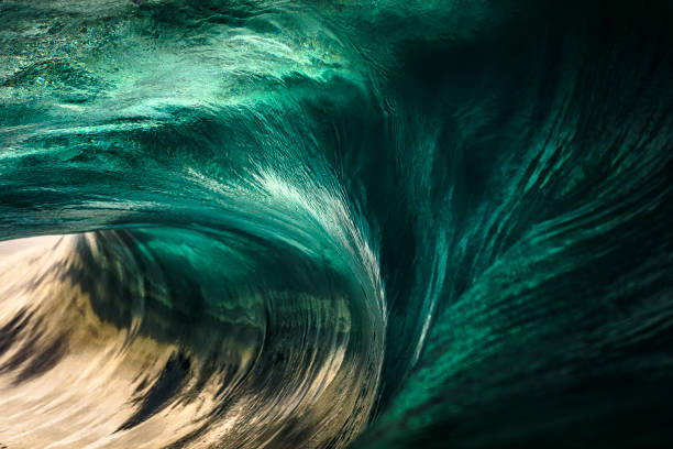 Close up of inside teal blue ocean wave