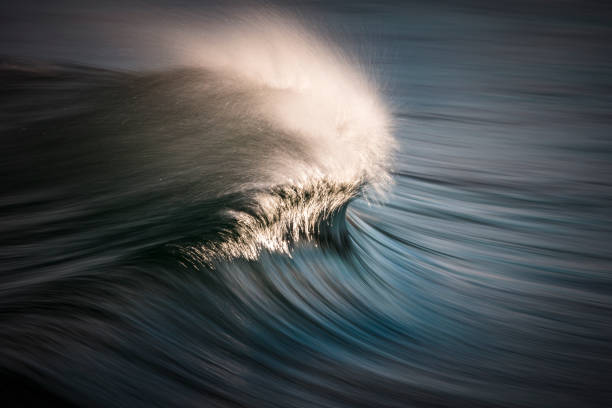 istock Blurred motion of glistening wave in sunlight 1386136331