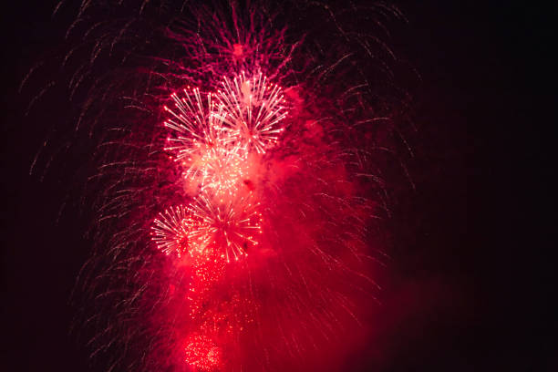 Holiday fireworks backgrounds with sparks, colored stars and bright nebula on black night sky universe, comets. Amazing beauty colorful fireworks display on celebration, showing. Holidays backgrounds