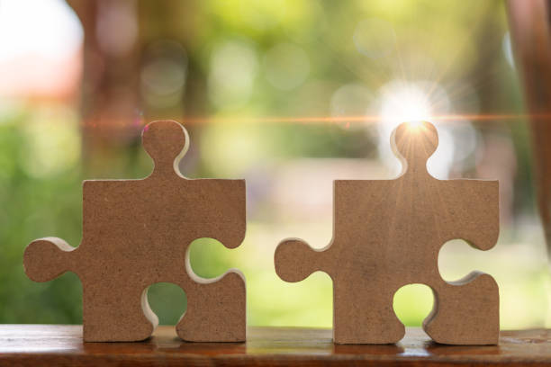 istock puzzle pieces on a green background 1386160314