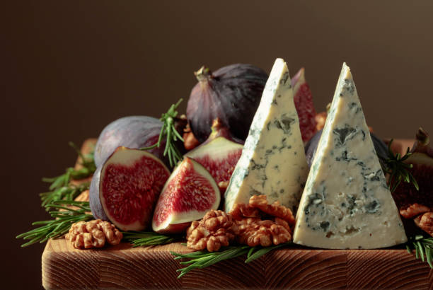 istock Blue cheese with figs, walnuts, and rosemary. 1386161528