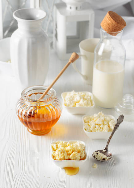 istock Fresh homemade cottage cheese with honey. 1386162224