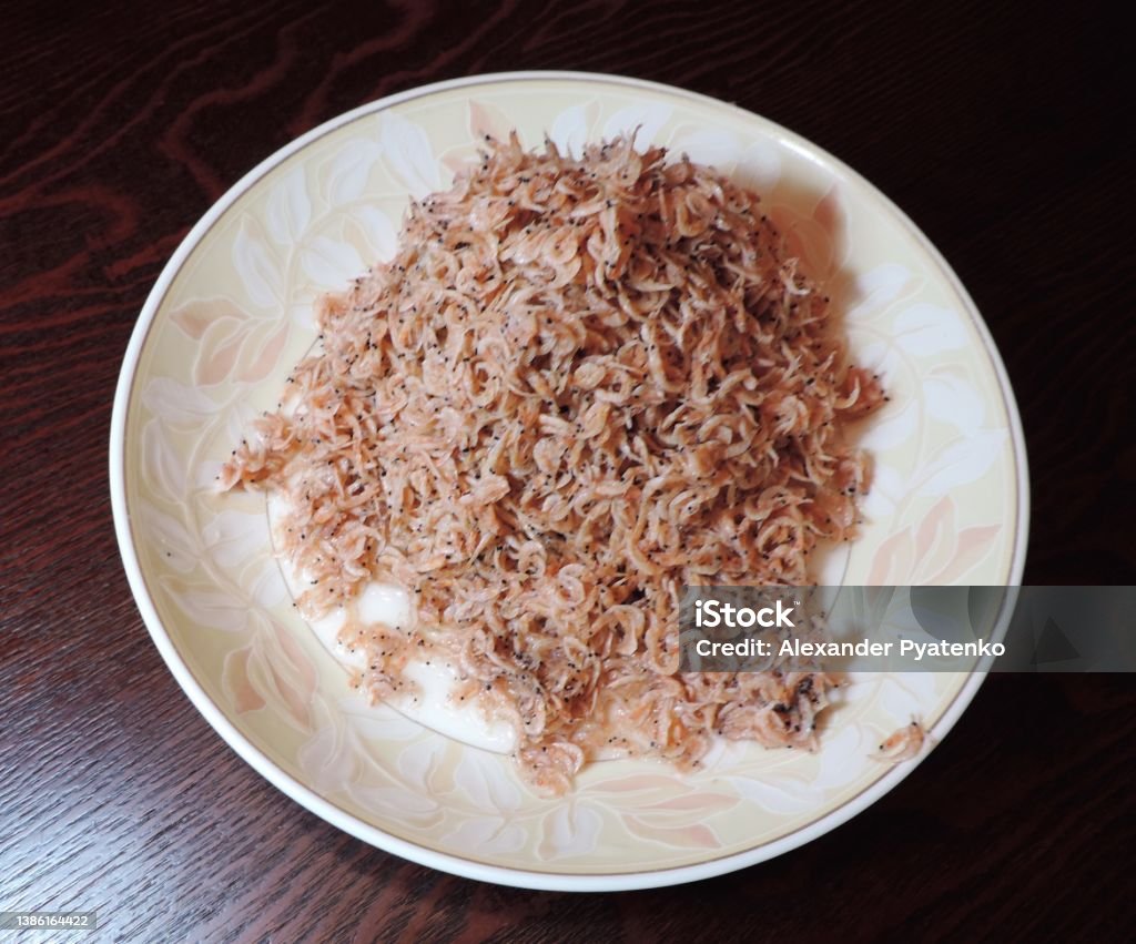 Japan. Plate with tiny dried shrimps. Small dried shrimps. Art Stock Photo