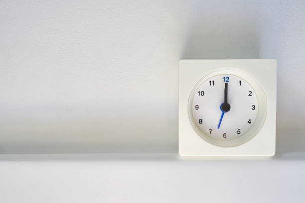 istock Clock on a light background with copy space. Scandinavian style in the room. Clock and time 1386164630