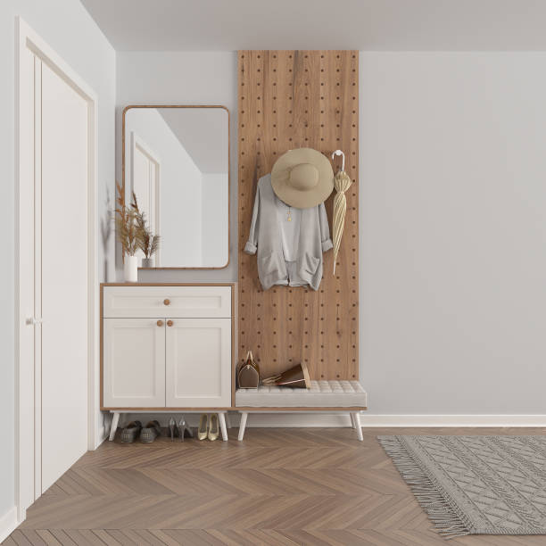 istock Modern scandinavian lobby, minimalist white hall with stucco walls, empty space with cabinet, mirror, bench, wooden coat hanger, shoes, clothes, umbrella. Copy space interior design 1386164712
