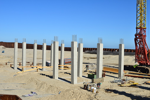 Blankenberge, West-Flanders, Belgium - March 17, 2022: 11 concrete vertical square columns with stainless steel bars