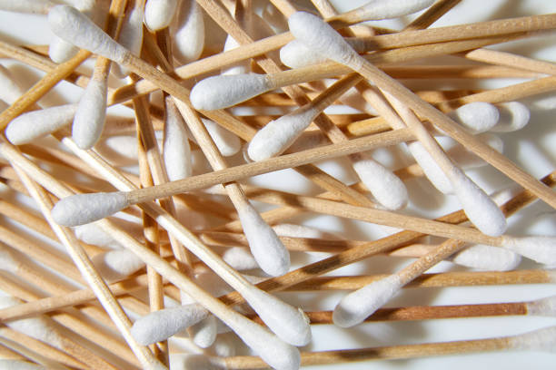 Flat lay Eco-friendly cotton swabs, bamboo cotton buds, Wooden sticks for cleaning ears on white background, copy space.