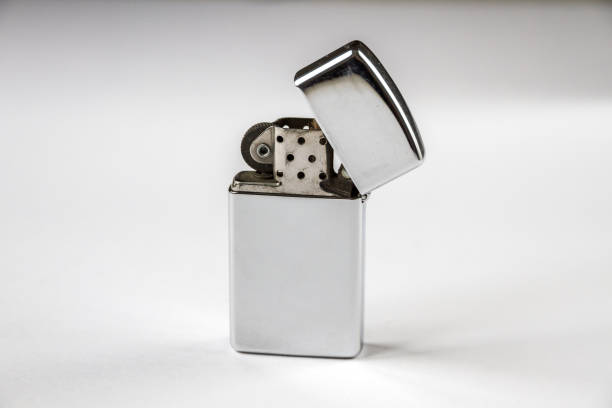 istock Old vintage lighter isolated on a white background 1386173579