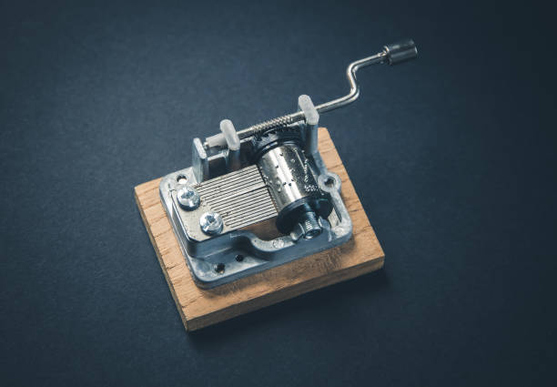 istock Traditional music box isolated on black 1386173638