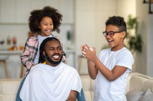 istock Boy touching shaving foam and watching dad and sister 1386176572