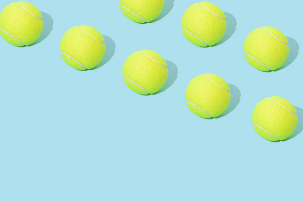 tennis ball pattern on a blue background. - tennis equipment imagens e fotografias de stock