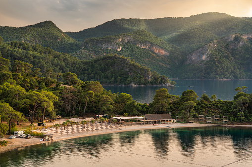 Beautiful sandy beach by the mountains in Fethiye Turkey and lagoon