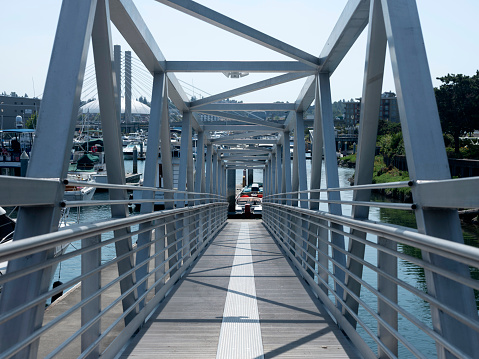 Metal bridge walkway to boat pier