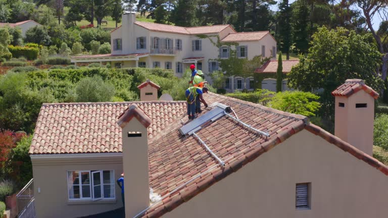 4k drone footage of solar panels being installed on the roof of a house