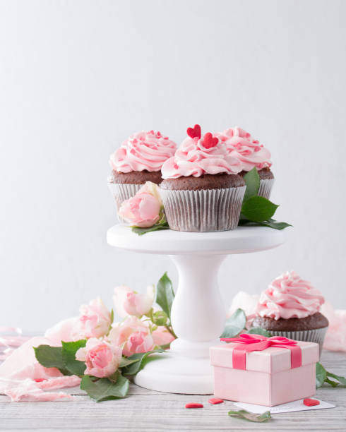 istock cupcake with pink frosting and rose 1386182619
