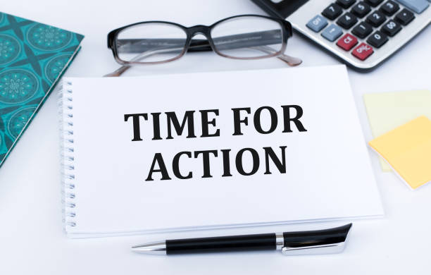 istock TIME FOR ACTION text on the paper sheet with chart,color paper and calculator 1386182639