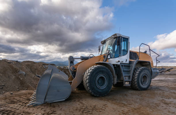 istock Excavator at a construction site moving earth and sand 1386184879