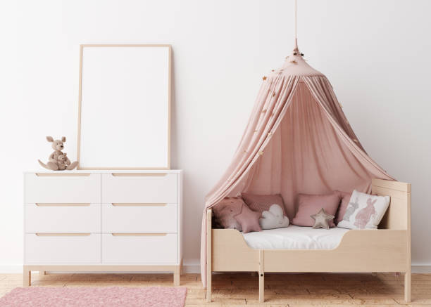 istock Empty vertical picture frame on white wall in modern child room. Mock up interior in scandinavian style. Free, copy space for your picture. Bed, console, toys. Cozy room for kids. 3D rendering. 1386190757
