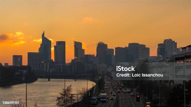 Orange Sky Over La Defense District Towers And Traffic Stock Photo - Download Image Now