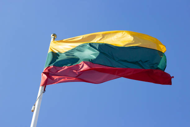 istock Lithuanian flag in the blue sky 1386192531