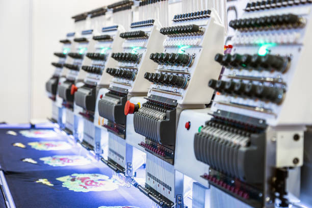 istock long line of modern and automatic high technology sewing machine 1386193484