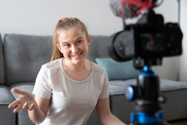 istock Teenager talking to professional camera 1386193729