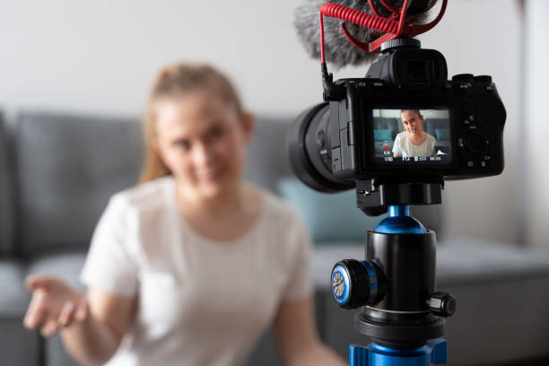 istock Rear view of camera recording influencer 1386193731