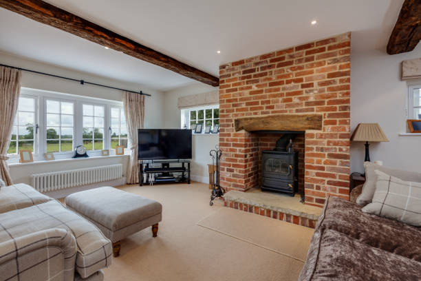istock Stylish traditional modern sitting room with fireplace 1386193770