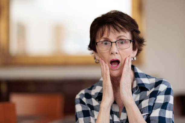 istock Shocked woman indoors. 1386193893