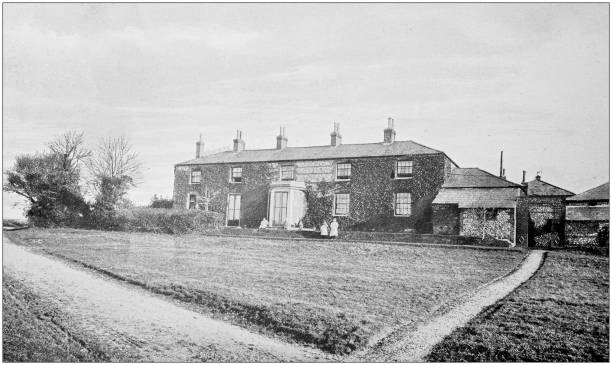 istock Antique vintage black and white photo: British countryside house 1386194974