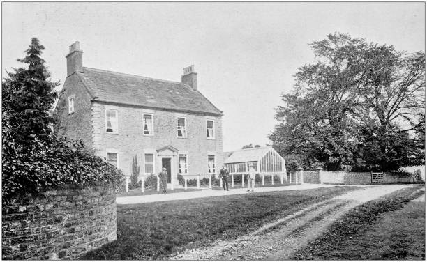 istock Antique vintage black and white photo: British countryside house 1386195054
