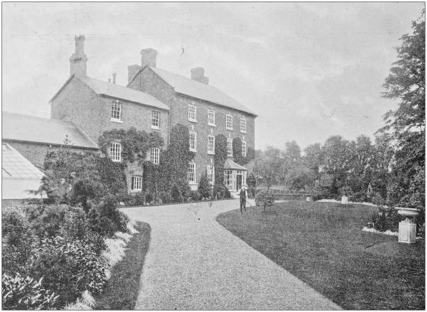 istock Antique vintage black and white photo: British countryside house 1386195076