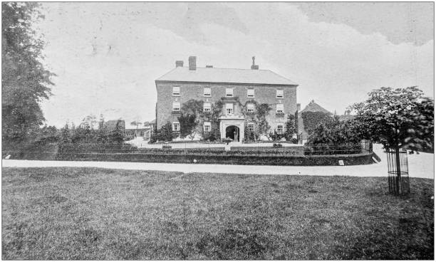 istock Antique vintage black and white photo: British countryside house 1386195089