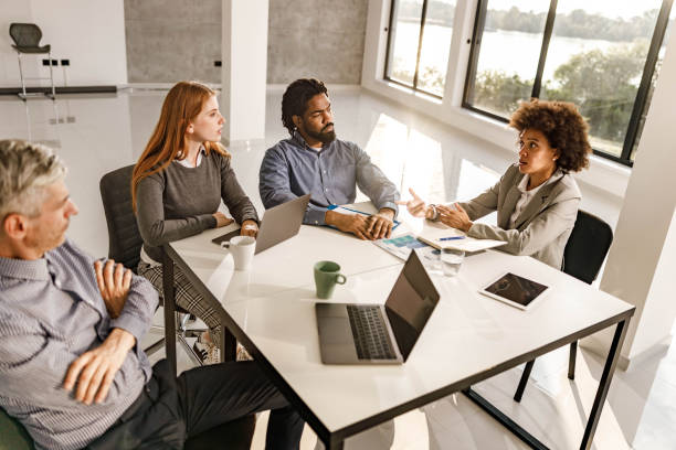 istock Business team talking on a meeting in the office. 1386196680