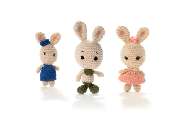 istock Amigurumi easter bunnies isolated on white background 1386197508