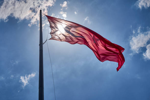 istock Turkish National Flag Wawing  Up In The Sky 1386197651