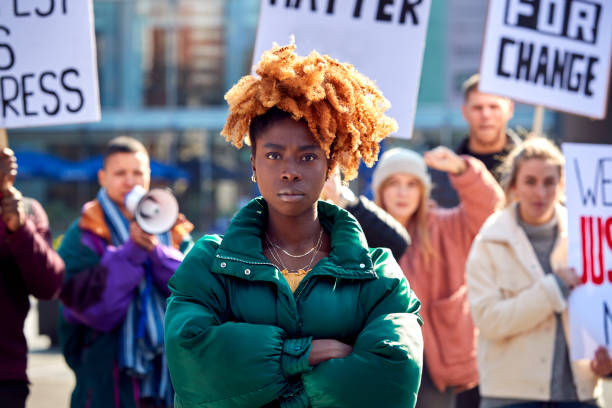 istock Protestors With Placards On protests Demonstration March Against Racism 1386198011