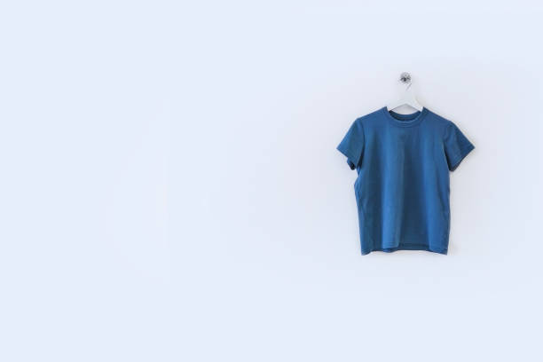 istock blue t-shirts mockup front used as design template isolated on white 1386198027