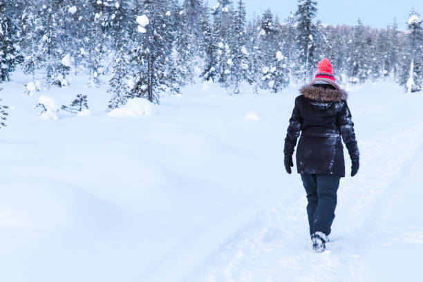 istock A woman walking in the snow 1386200731