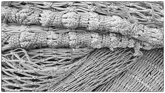 macro rope background,Super close up of a thick rope in shape of a spiral,Photo of an old vintage rope. Natural warm light