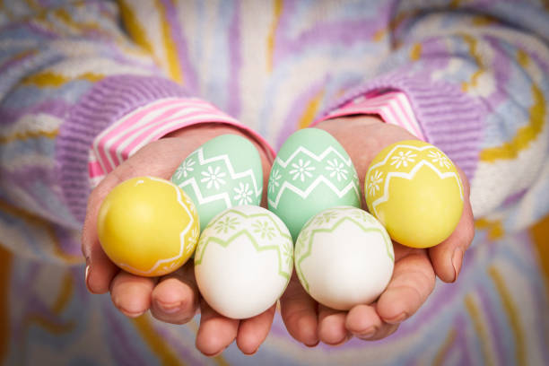 Studio shots of woman over yellow background Easter style. High quality photo