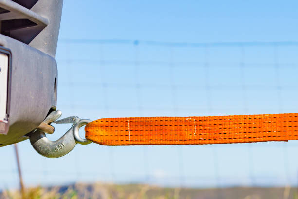 Tow hook with orange strap on car. Towing equipment. Tugging