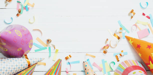 istock birthday decoration on white wooden background 1386204744