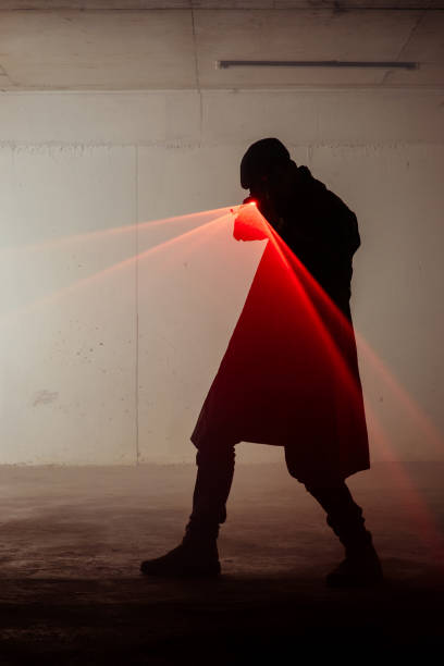 istock Figure of a man holding laser gun 1386207100