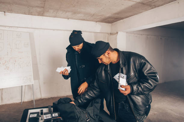 istock Criminals counting stolen cash 1386208281