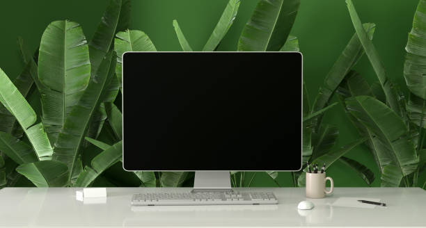 istock laptop on a desk - mock up 1386208462